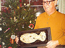 My father holding his plaque with a paper mache fish