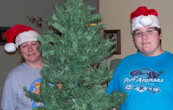 Rhonda (in her favorite gingerbread shirt) and her son prepare for a joyous Christmas, 2009.
