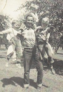 Dad holding my cousins
